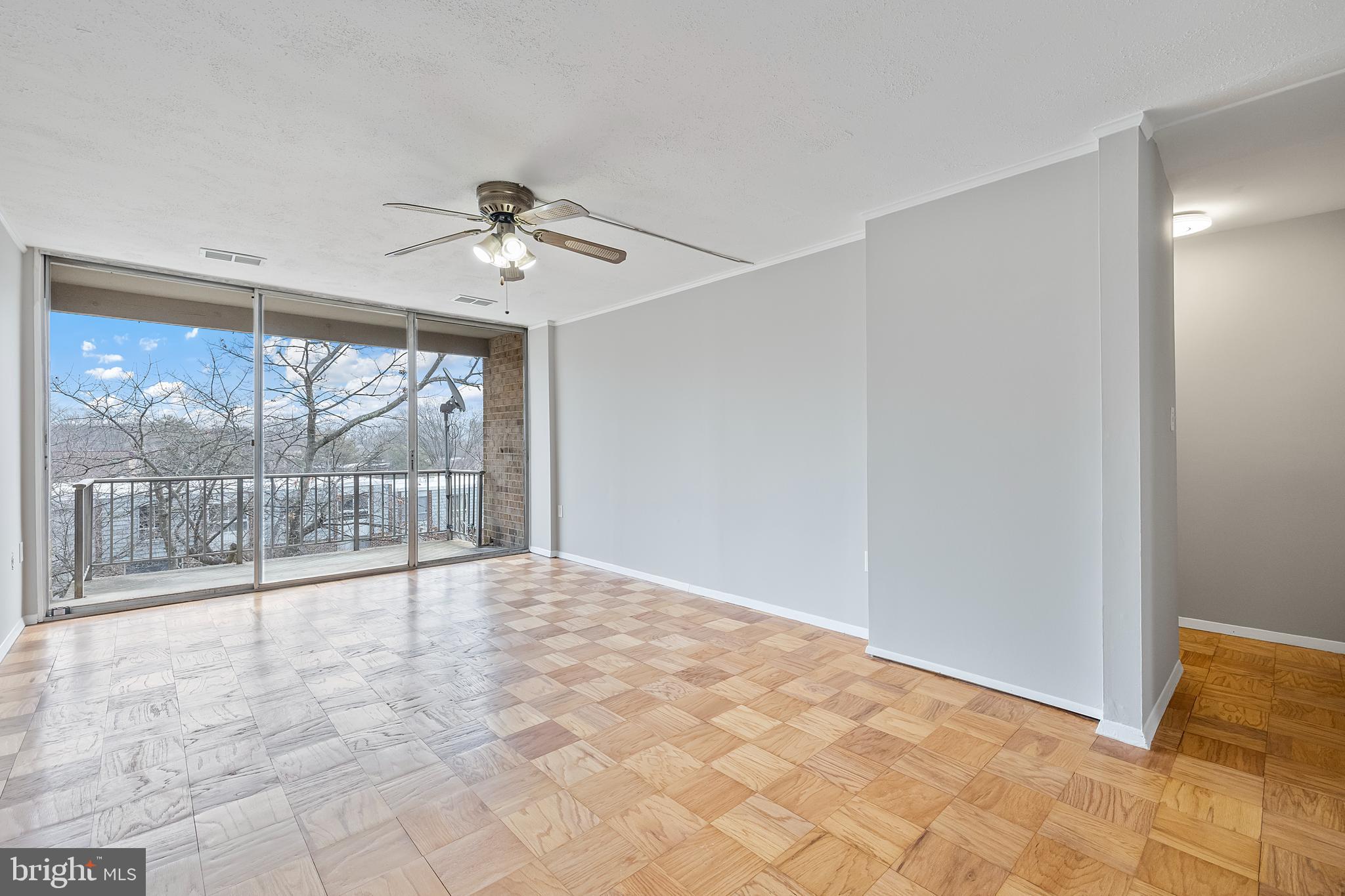 3902 Bel Pre Road, Unit 39028 Silver Spring, MD 20906 - Photo 3 of 31 a view of an empty room with a window