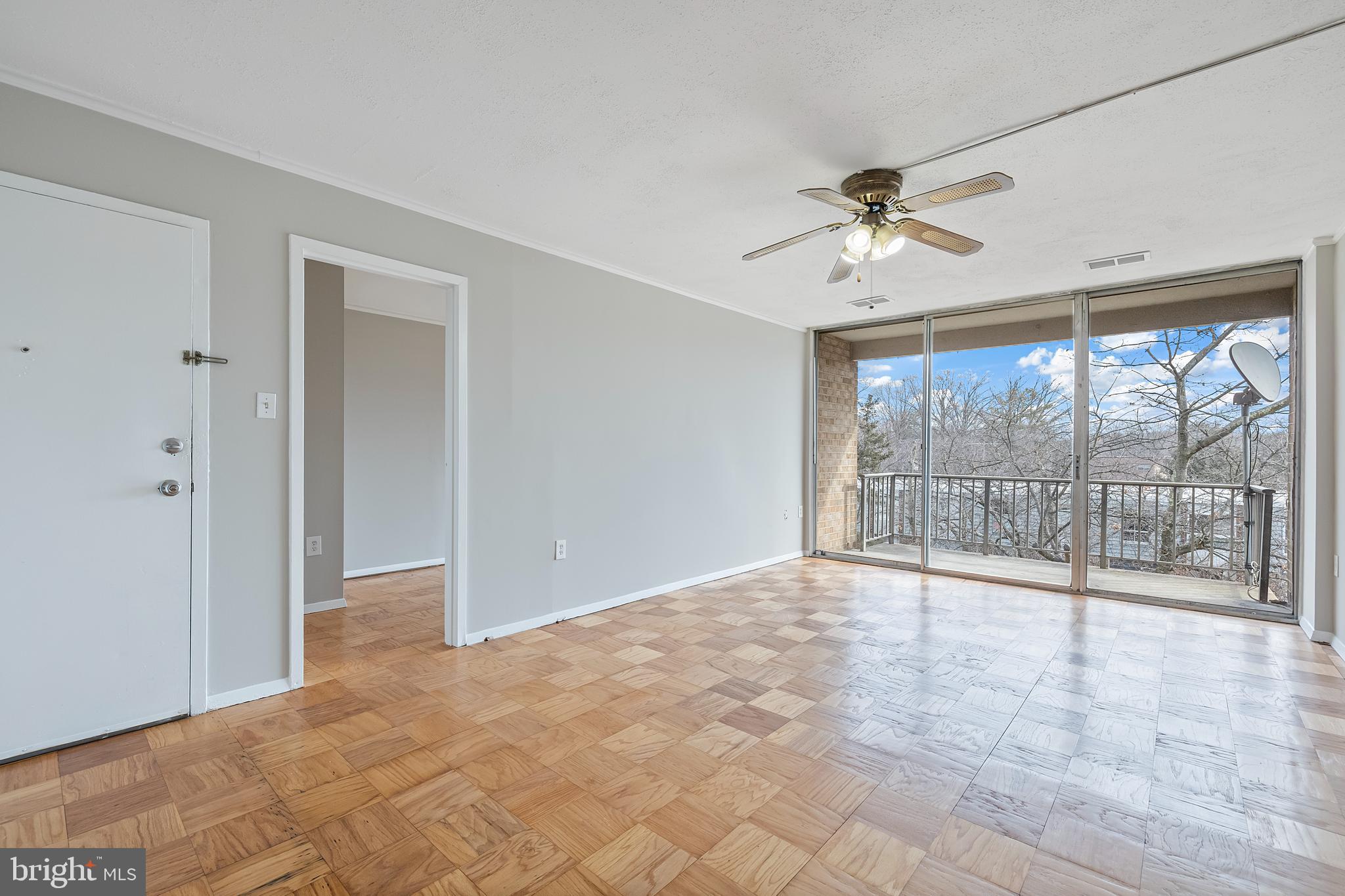 3902 Bel Pre Road, Unit 39028 Silver Spring, MD 20906 - Photo 4 of 31 a view of an empty room with a window