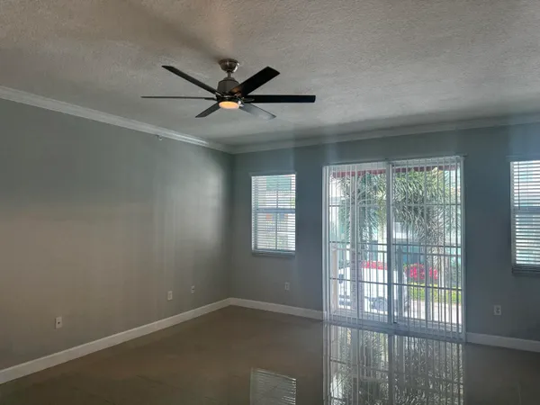a view of an empty room with a window