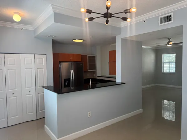 a view of a hallway with a cabinet and a mirror