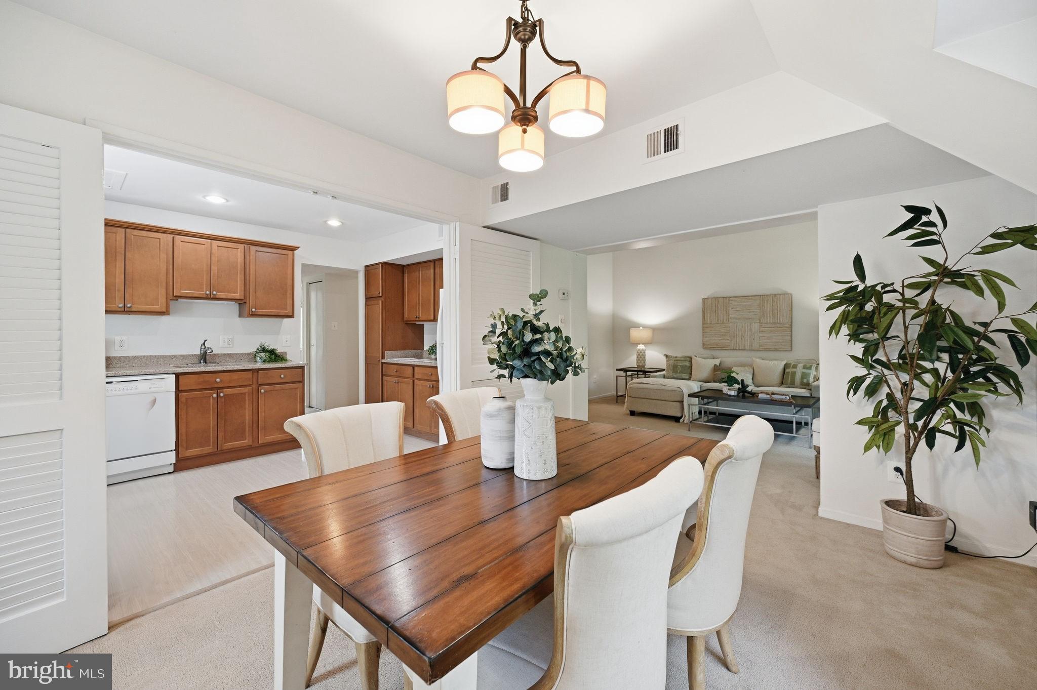 1659 Parkcrest Circle, Unit C Reston, VA 20190 - Photo 15 of 31 a kitchen with a table and chairs in it