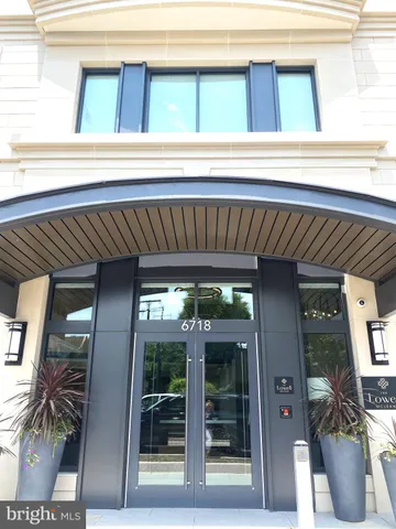 a front view of a house with outdoor seating and shower