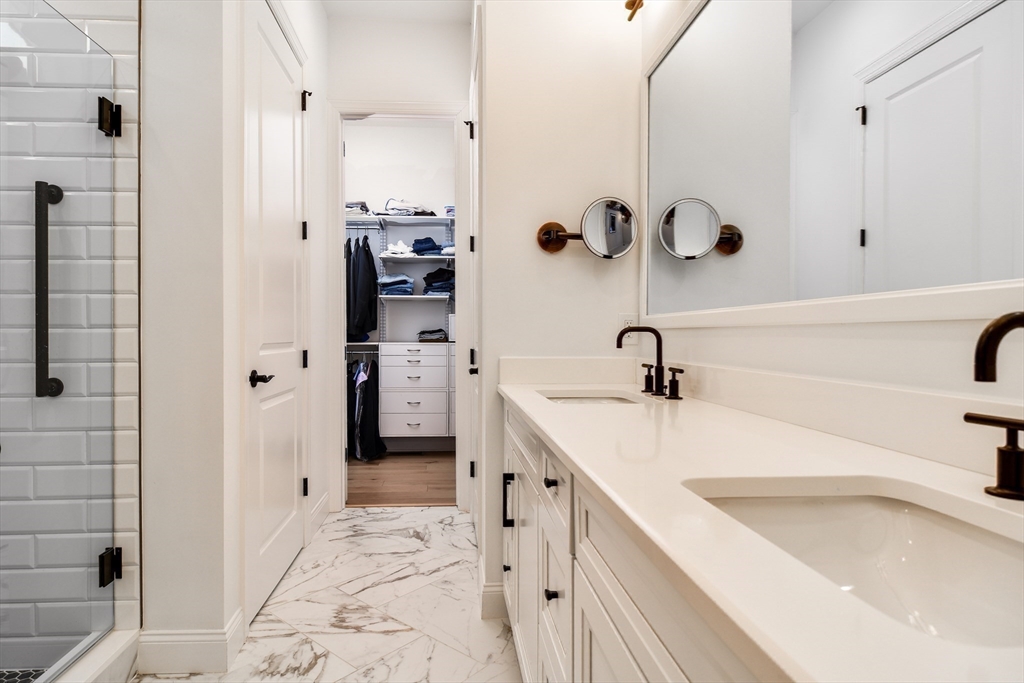 16 Barnes Boulevard, Unit 16 Hudson, MA 01749 - Photo 14 of 42 a bathroom with a sink and a shower