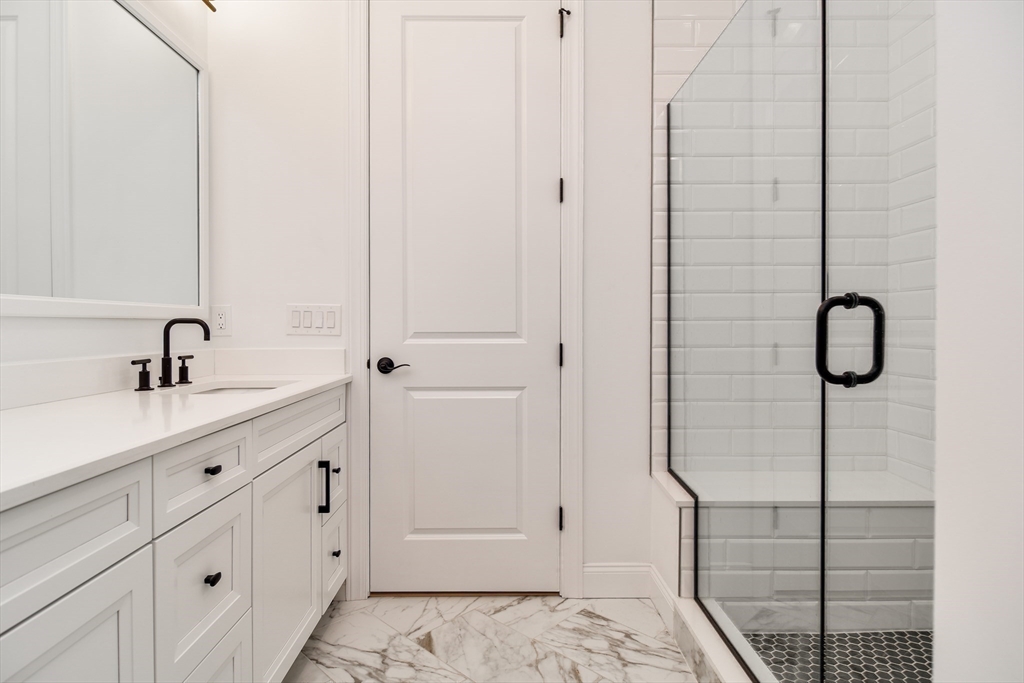 16 Barnes Boulevard, Unit 16 Hudson, MA 01749 - Photo 15 of 42 a bathroom with a shower and a sink