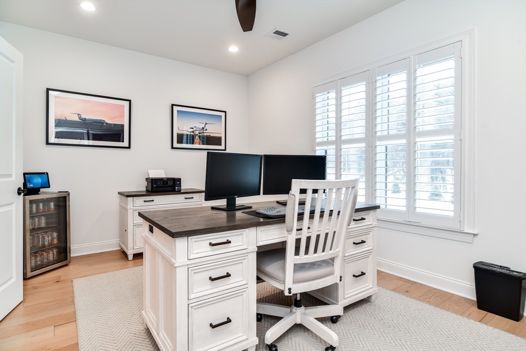 16 Barnes Boulevard, Unit 16 Hudson, MA 01749 - Photo 22 of 42 a view of a workspace with furniture and a window