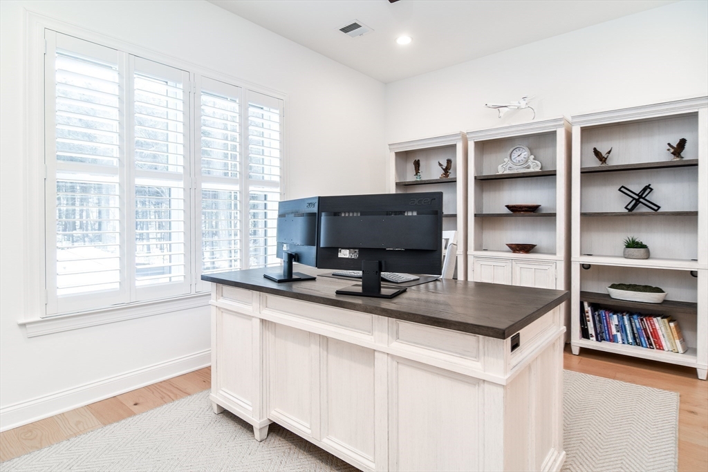 16 Barnes Boulevard, Unit 16 Hudson, MA 01749 - Photo 23 of 42 a kitchen with stainless steel appliances a sink and a stove