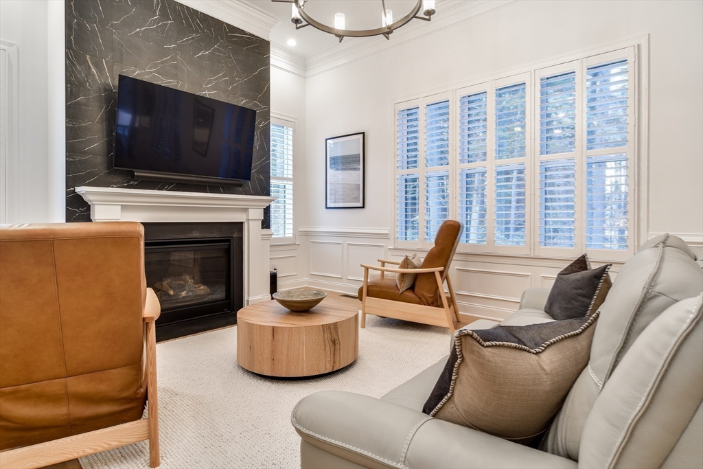 16 Barnes Boulevard, Unit 16 Hudson, MA 01749 - Photo 3 of 42 a living room with furniture and a flat screen tv