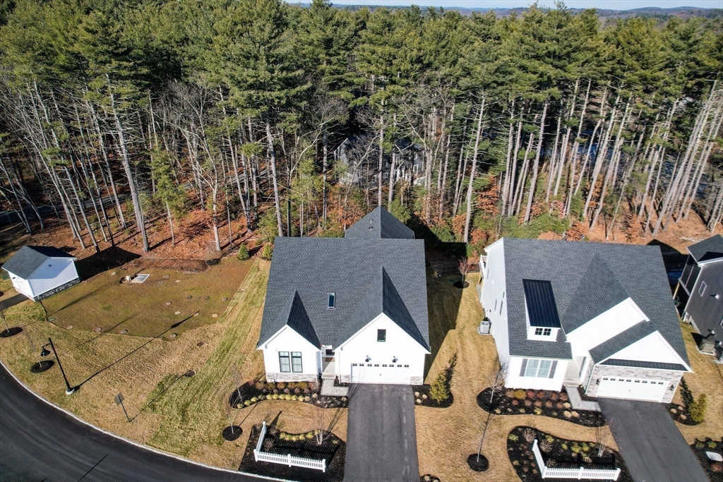 16 Barnes Boulevard, Unit 16 Hudson, MA 01749 - Photo 36 of 42 an aerial view of residential houses with outdoor space