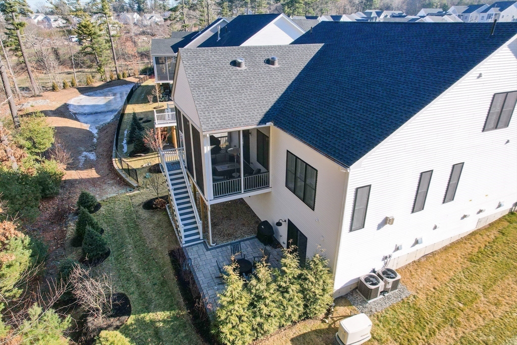 16 Barnes Boulevard, Unit 16 Hudson, MA 01749 - Photo 38 of 42 a aerial view of a house with swimming pool