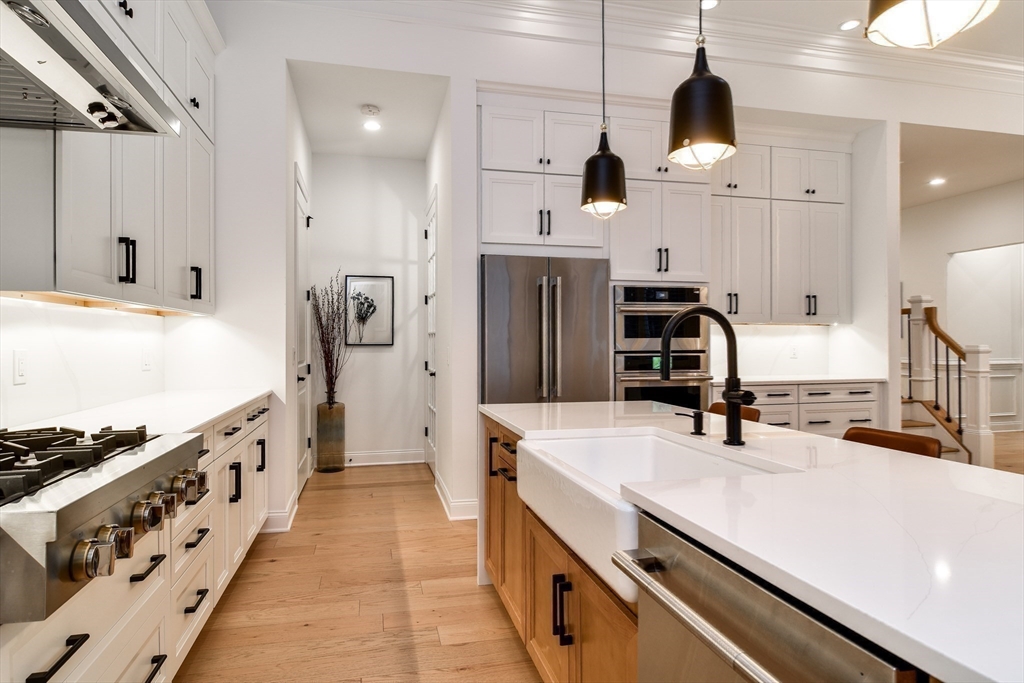 16 Barnes Boulevard, Unit 16 Hudson, MA 01749 - Photo 8 of 42 a kitchen with stainless steel appliances a sink stove and refrigerator