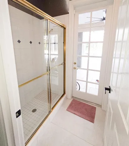 a kitchen with granite countertop a sink and cabinets