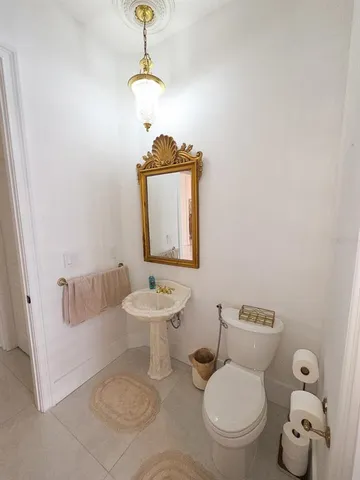 a large kitchen with kitchen island a sink a counter space and stainless steel appliances