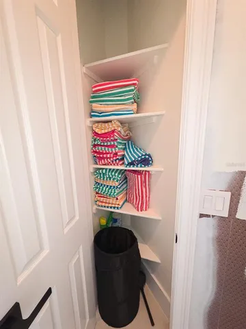 a kitchen with granite countertop a stove sink and cabinets