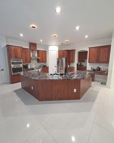 a white toilet sitting next to a bath tub and a shower