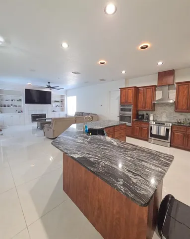 a bedroom with furniture and a flat screen tv