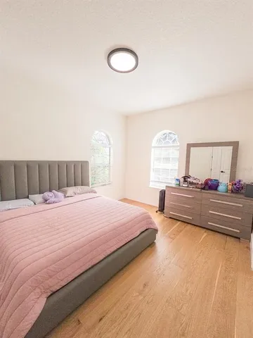 a bedroom with a bed and a table