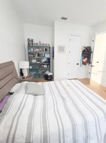 a view of swimming pool with umbrella in front of house