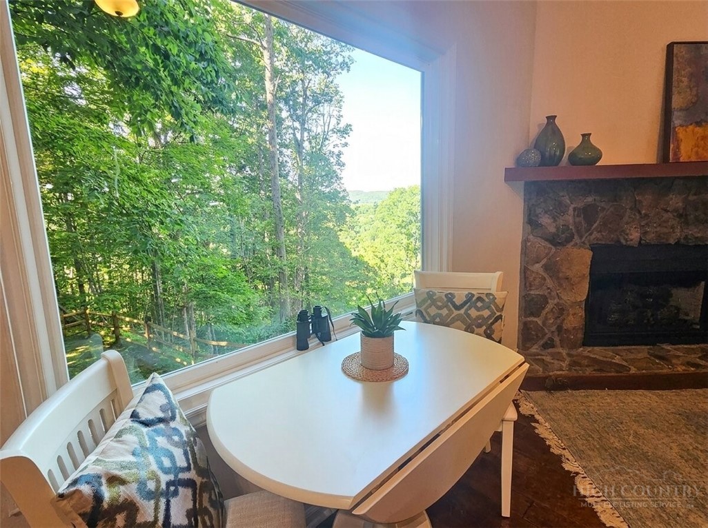 159 Easy Street Boone, NC 28607 - Photo 17 of 46 a view of a dining room with furniture window and wooden floor