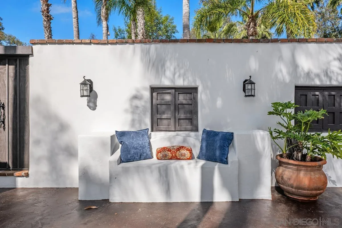 17507 Los Morros Rancho Santa Fe, CA 92067 - Photo 25 of 60 a table with a couch and a potted plant