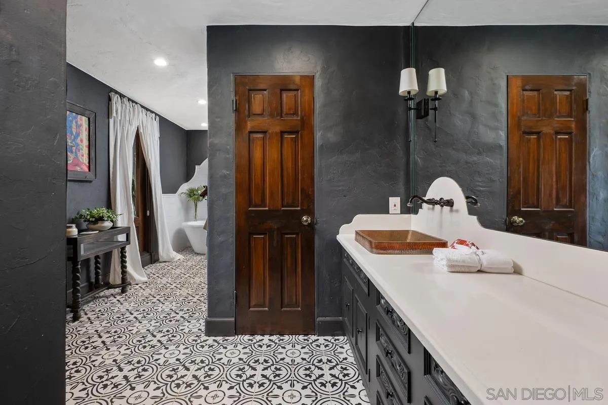 17507 Los Morros Rancho Santa Fe, CA 92067 - Photo 41 of 60 a bathroom with a sink and a mirror