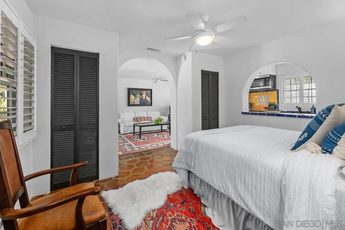 17507 Los Morros Rancho Santa Fe, CA 92067 - Photo 44 of 60 a bed room with a bed and a lamp