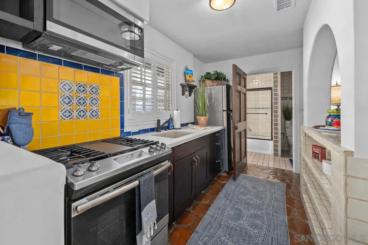 17507 Los Morros Rancho Santa Fe, CA 92067 - Photo 46 of 60 a kitchen with stainless steel appliances granite countertop a stove and a refrigerator