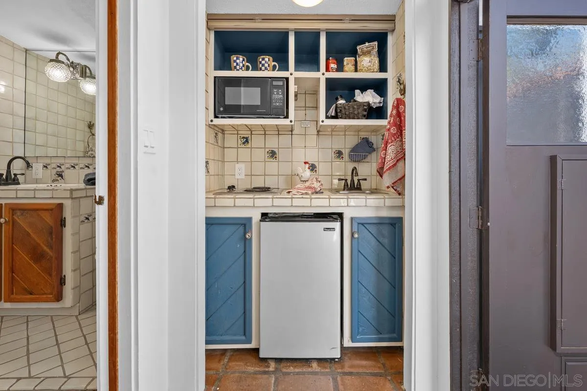17507 Los Morros Rancho Santa Fe, CA 92067 - Photo 58 of 60 a bathroom with a sink and a mirror