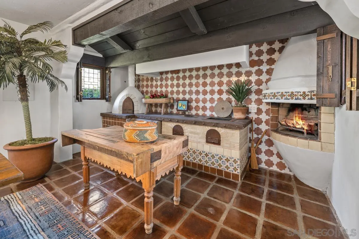 17507 Los Morros Rancho Santa Fe, CA 92067 - Photo 8 of 60 a kitchen with a stove a sink and a microwave