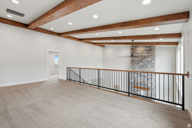 2970 North Mahogany Vly Road Logan, UT 84341 - Photo 20 of 39 Carpeted empty room with beam ceiling, ceiling fan, and recessed lighting