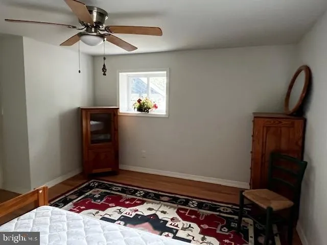 a view of room with a flat screen tv and fan