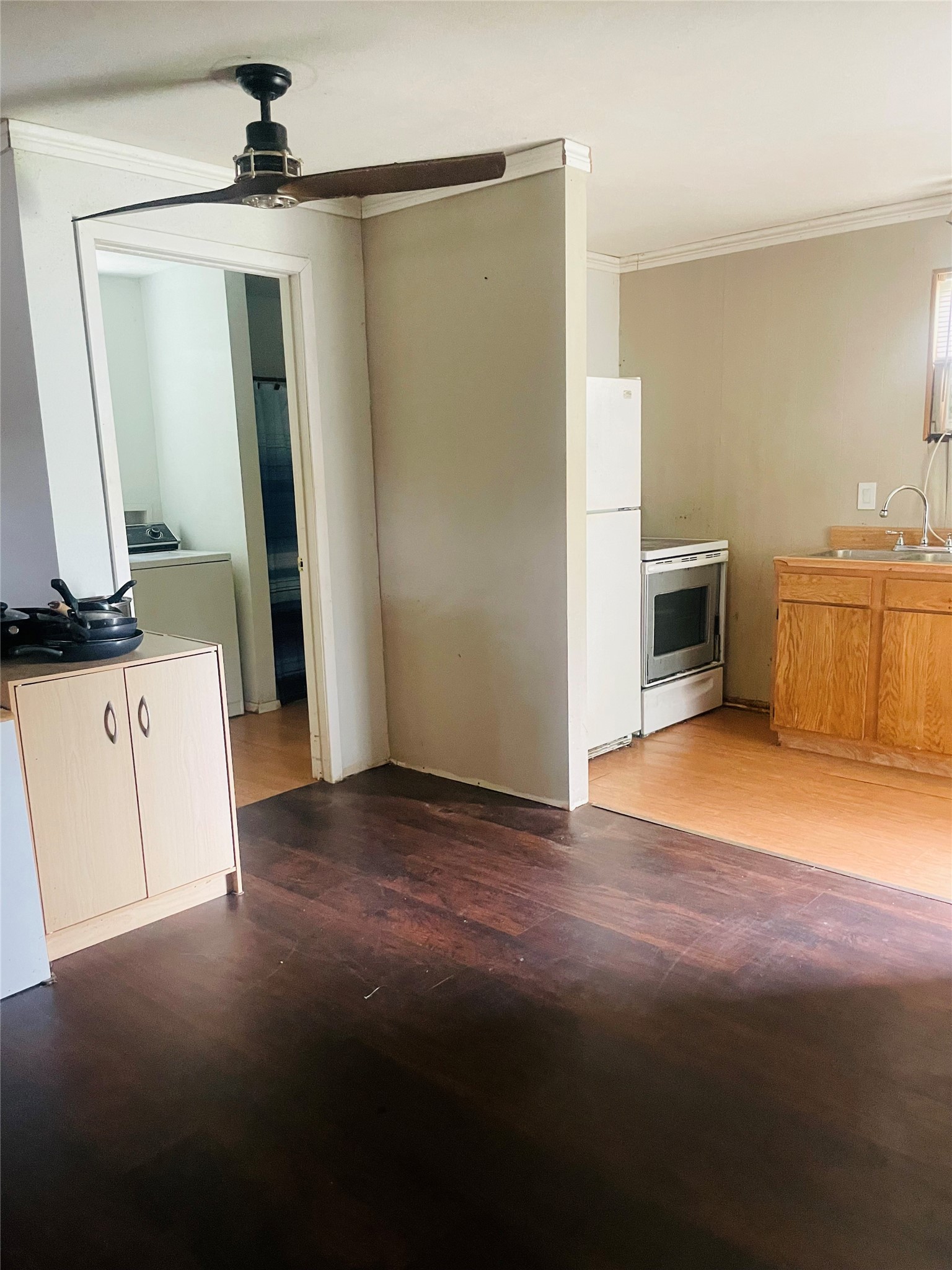255 Bluebonnet Livingston, TX 77351 - Photo 4 of 7 a view of a kitchen with a sink and a refrigerator