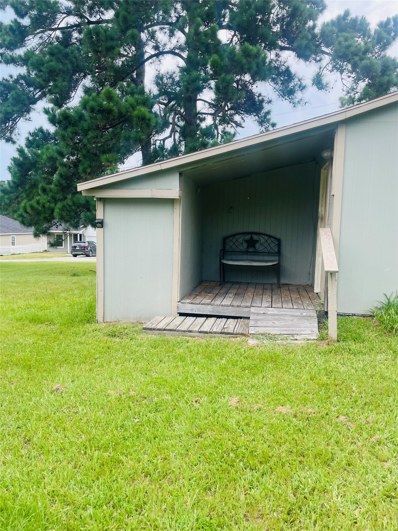 255 Bluebonnet Livingston, TX 77351 - Photo 5 of 7 a view of a backyard with a garden and plants