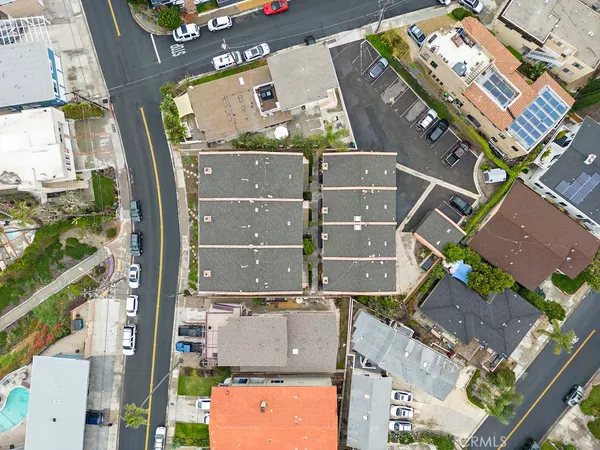 an aerial view of houses with outdoor space