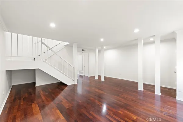 a view of an entryway with wooden floor