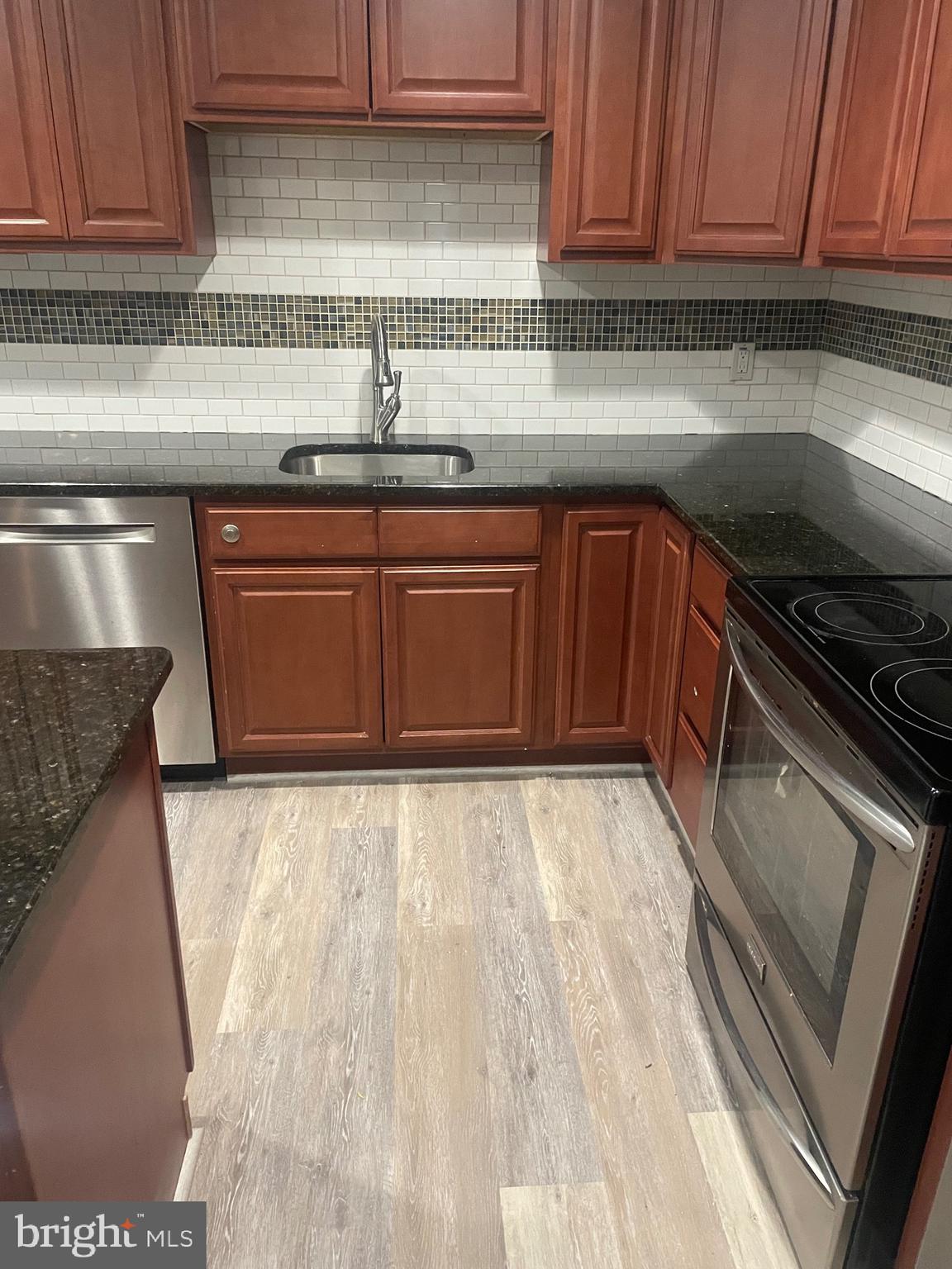 1300 Shadyside Road Downingtown, PA 19335 - Photo 17 of 17 a kitchen with granite countertop a sink and cabinets