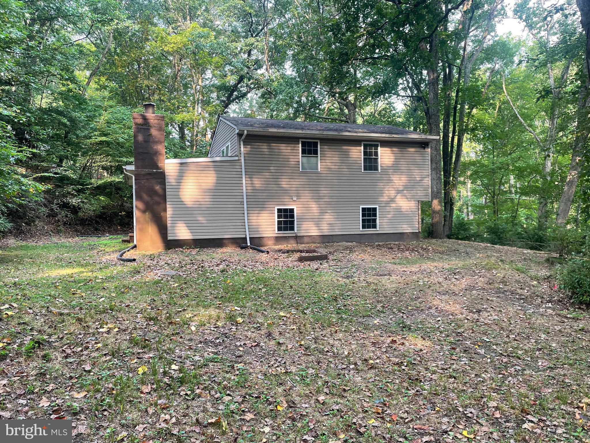 1300 Shadyside Road Downingtown, PA 19335 - Photo 2 of 17 a backyard of a house with table and chairs