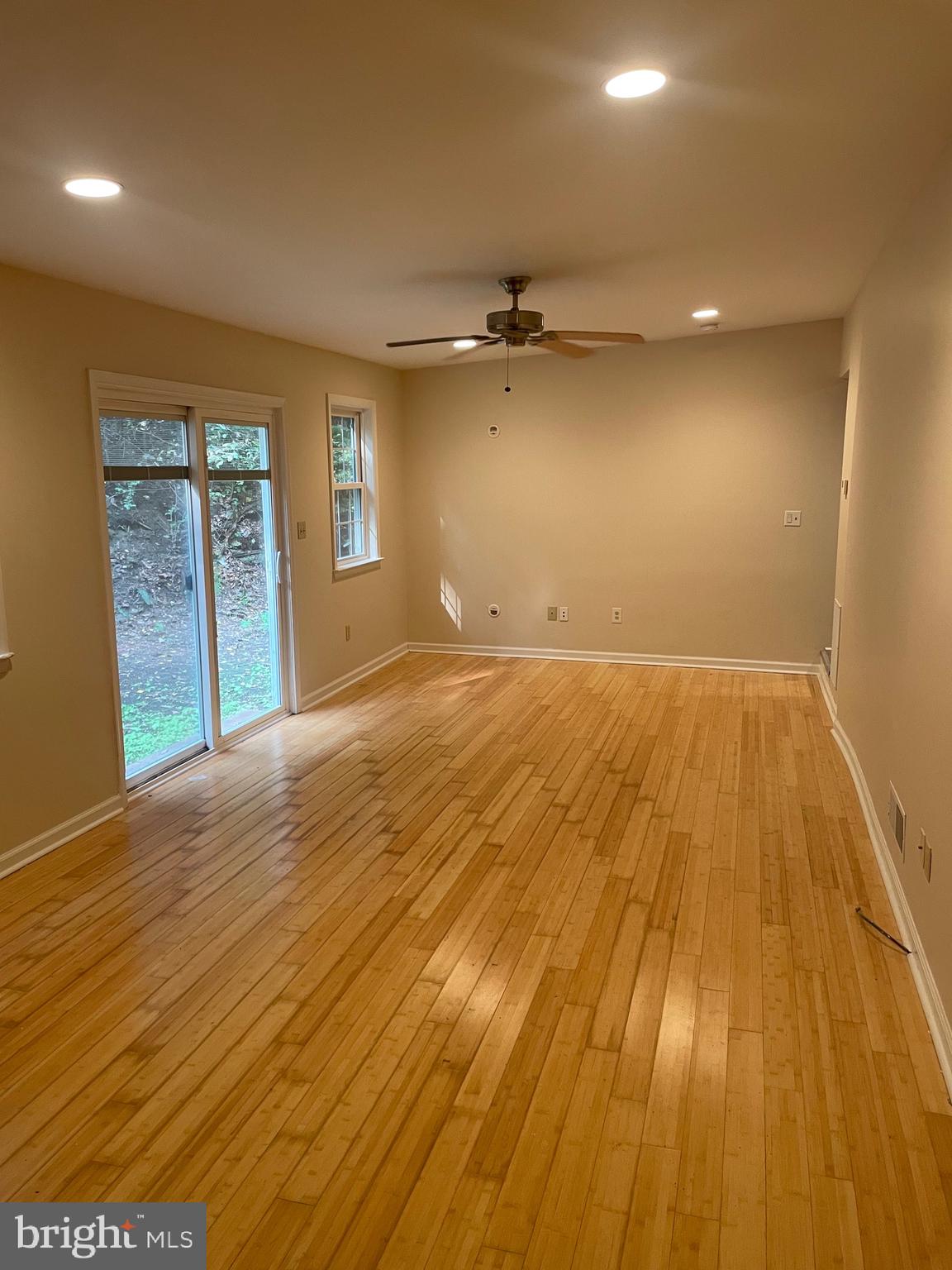 1300 Shadyside Road Downingtown, PA 19335 - Photo 7 of 17 an empty room with wooden floor and windows