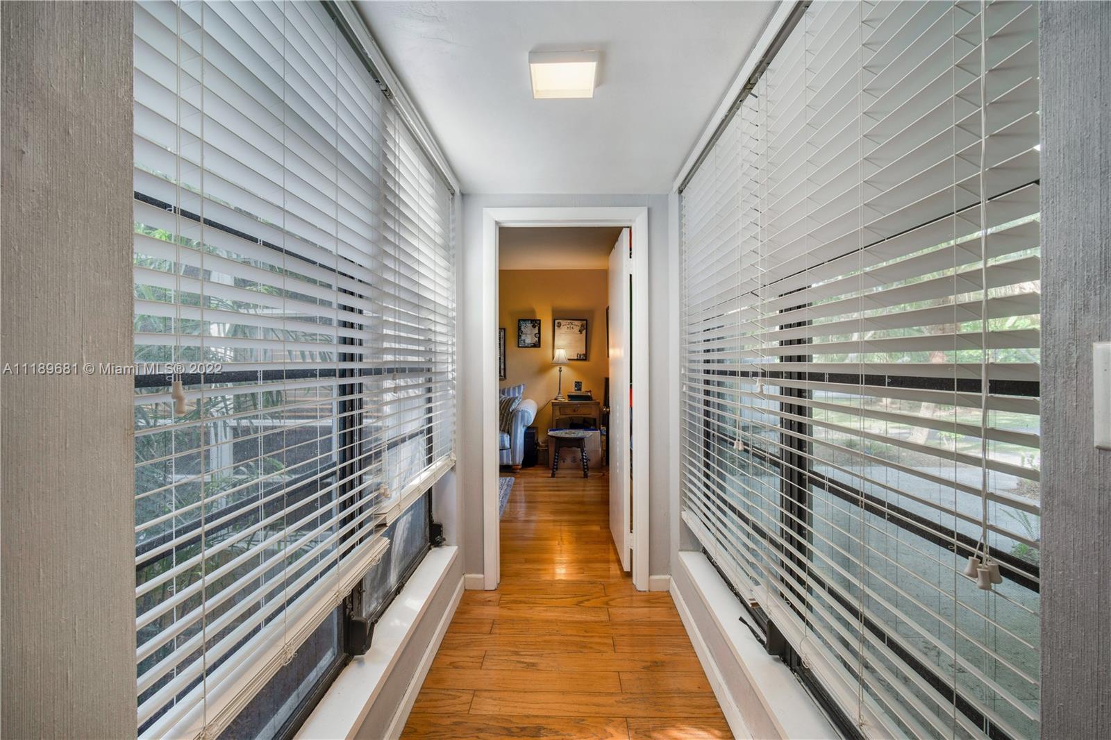 6465 Southwest 126th Street Road Pinecrest, FL 33156 - Photo 11 of 37 a view of a balcony with wooden floor