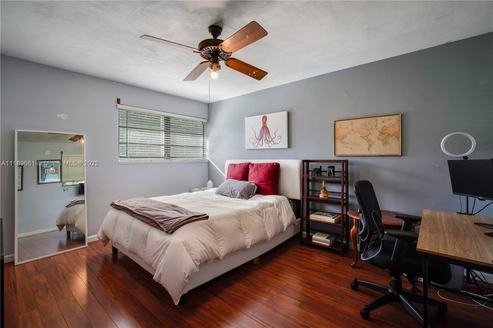 6465 Southwest 126th Street Road Pinecrest, FL 33156 - Photo 19 of 37 a bedroom with a bed and a desk