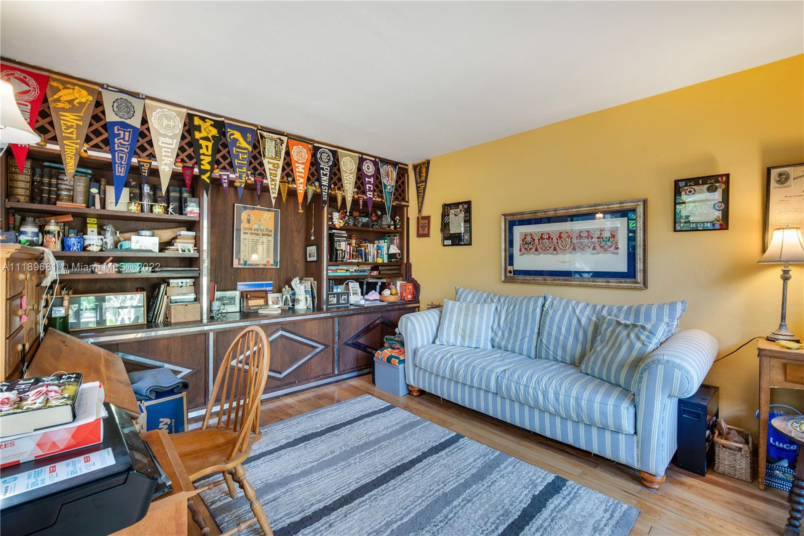 6465 Southwest 126th Street Road Pinecrest, FL 33156 - Photo 25 of 37 a living room with furniture a couch and a floor to ceiling window