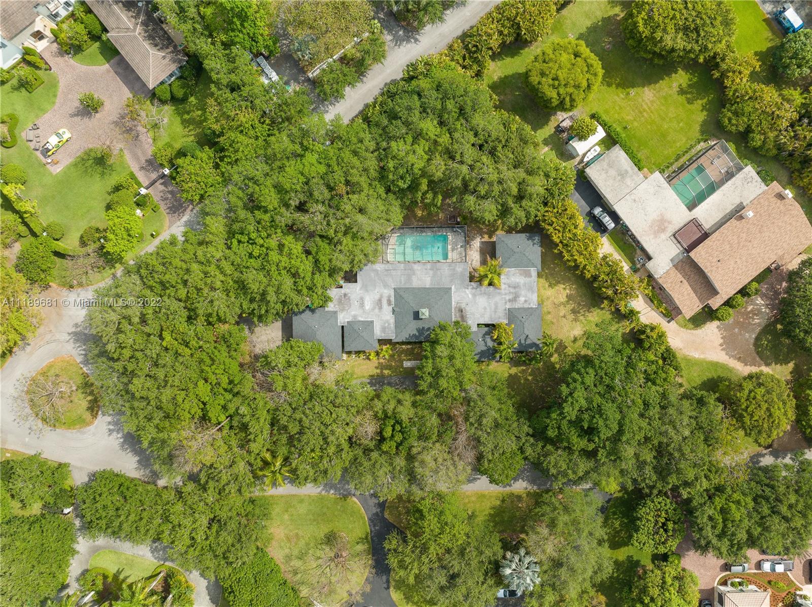 6465 Southwest 126th Street Road Pinecrest, FL 33156 - Photo 31 of 37 an aerial view of a house with a yard