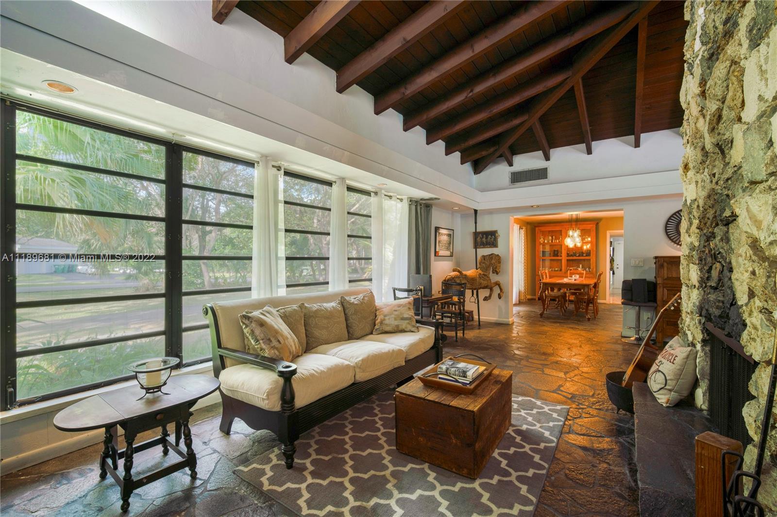 6465 Southwest 126th Street Road Pinecrest, FL 33156 - Photo 36 of 37 a living room with furniture and a large window