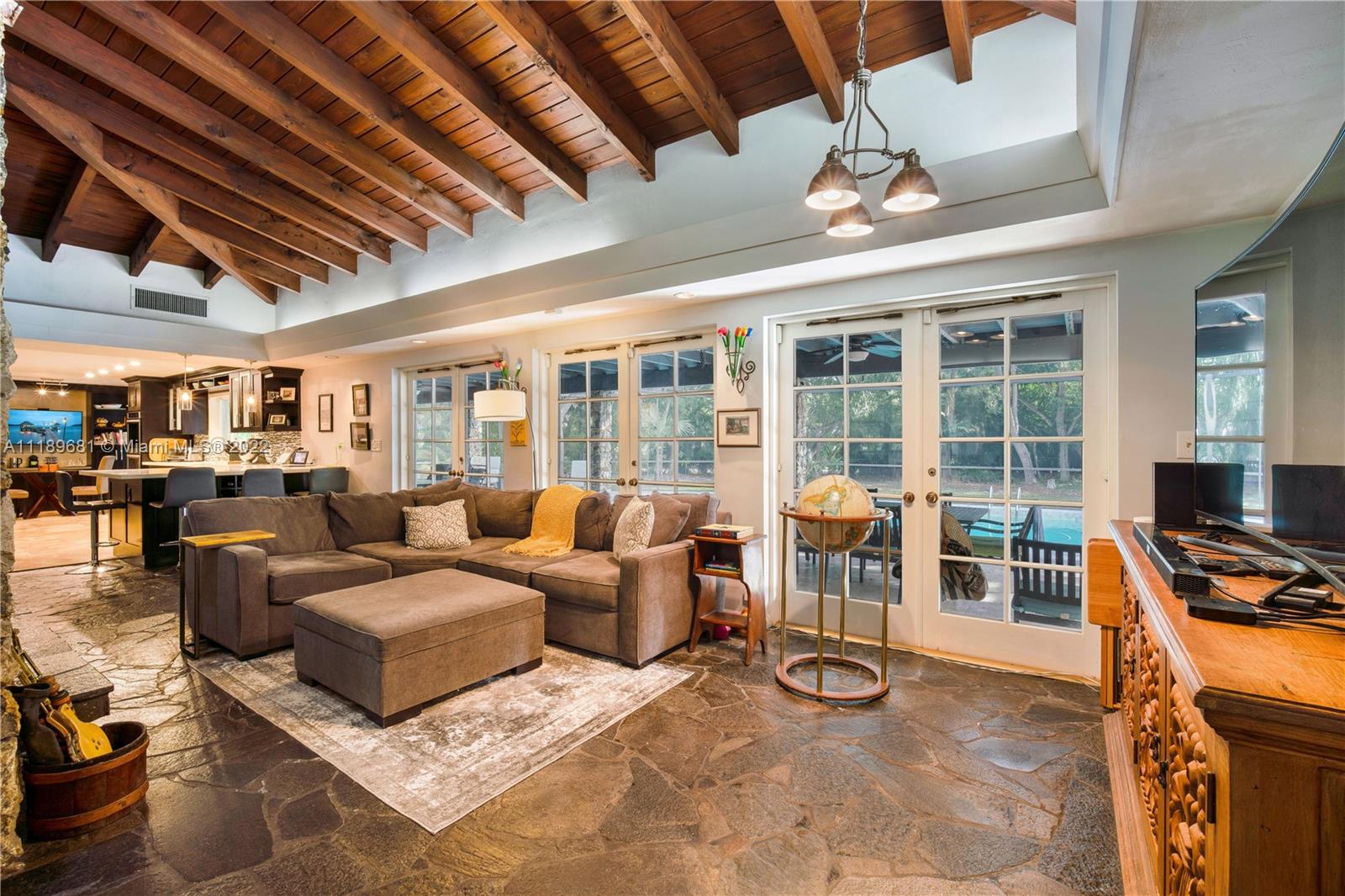 6465 Southwest 126th Street Road Pinecrest, FL 33156 - Photo 8 of 37 a view of a livingroom with furniture and floor to ceiling window