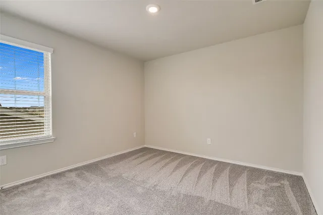 a view of a room that has a window in it