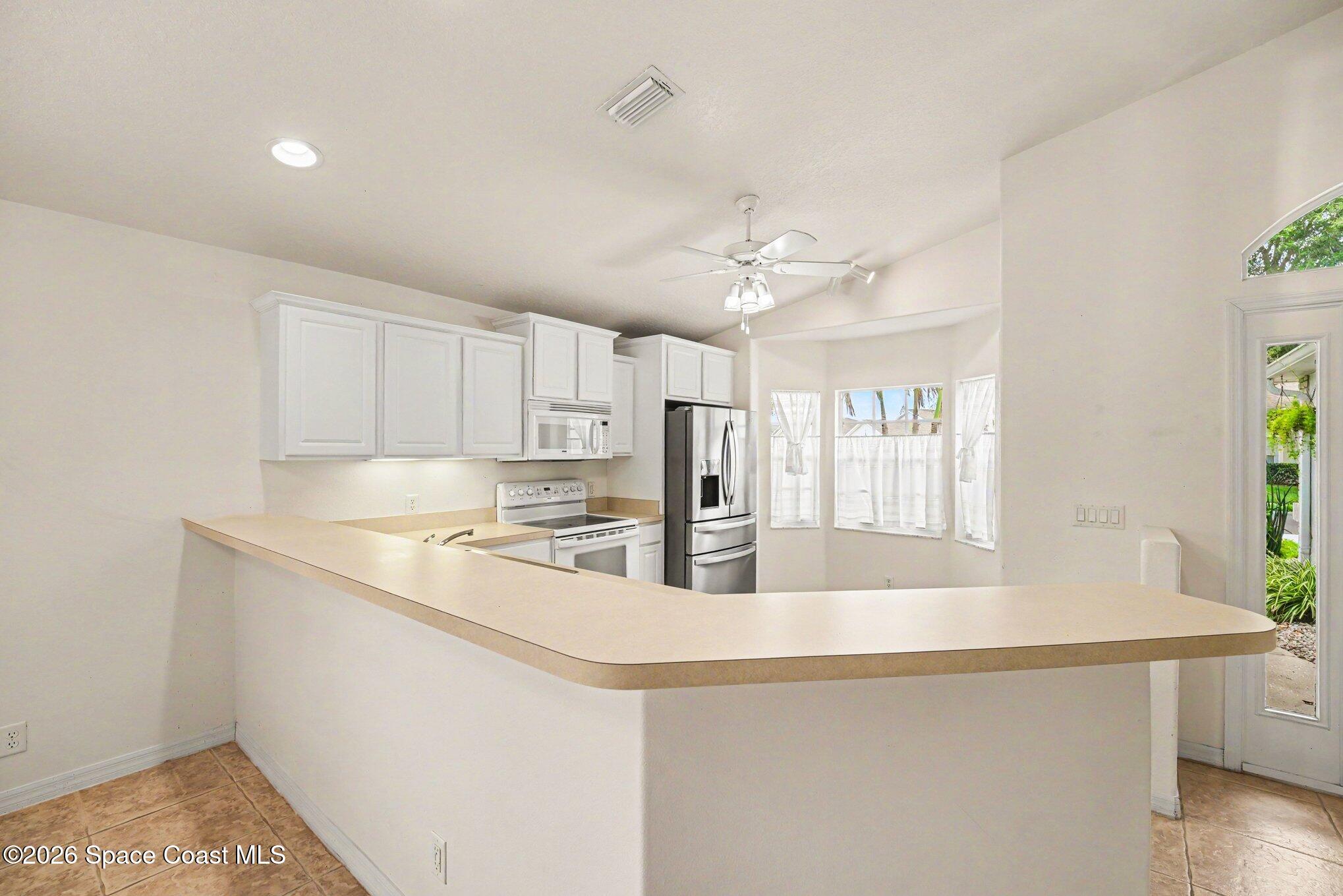 2194 Spring Creek Circle Palm Bay, FL 32905 - Photo 8 of 40 Long Breakfast Bar
