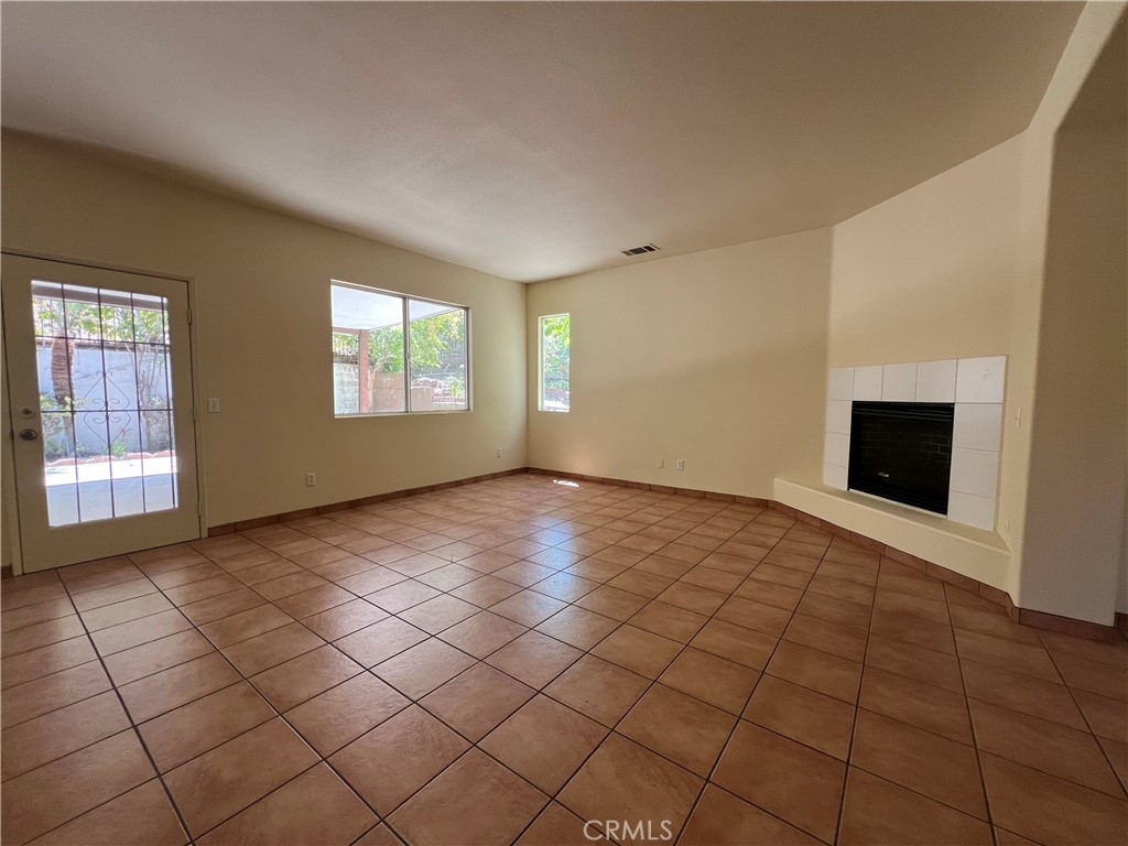16200 Setting Sun Circle Riverside, CA 92503 - Photo 2 of 20 a view of an empty room with window and fireplace
