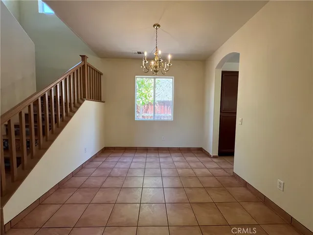 a view of an empty room and glass door