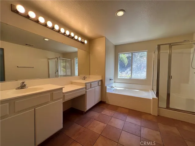 a bathroom with a sink a vanity and mirror