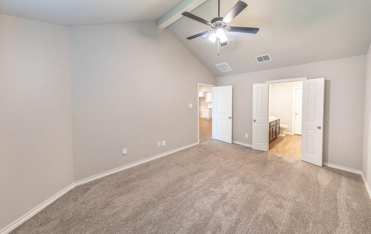 2545 137th Street Lubbock, TX 79423 - Photo 10 of 26 a view of an empty room and a ceiling fan window