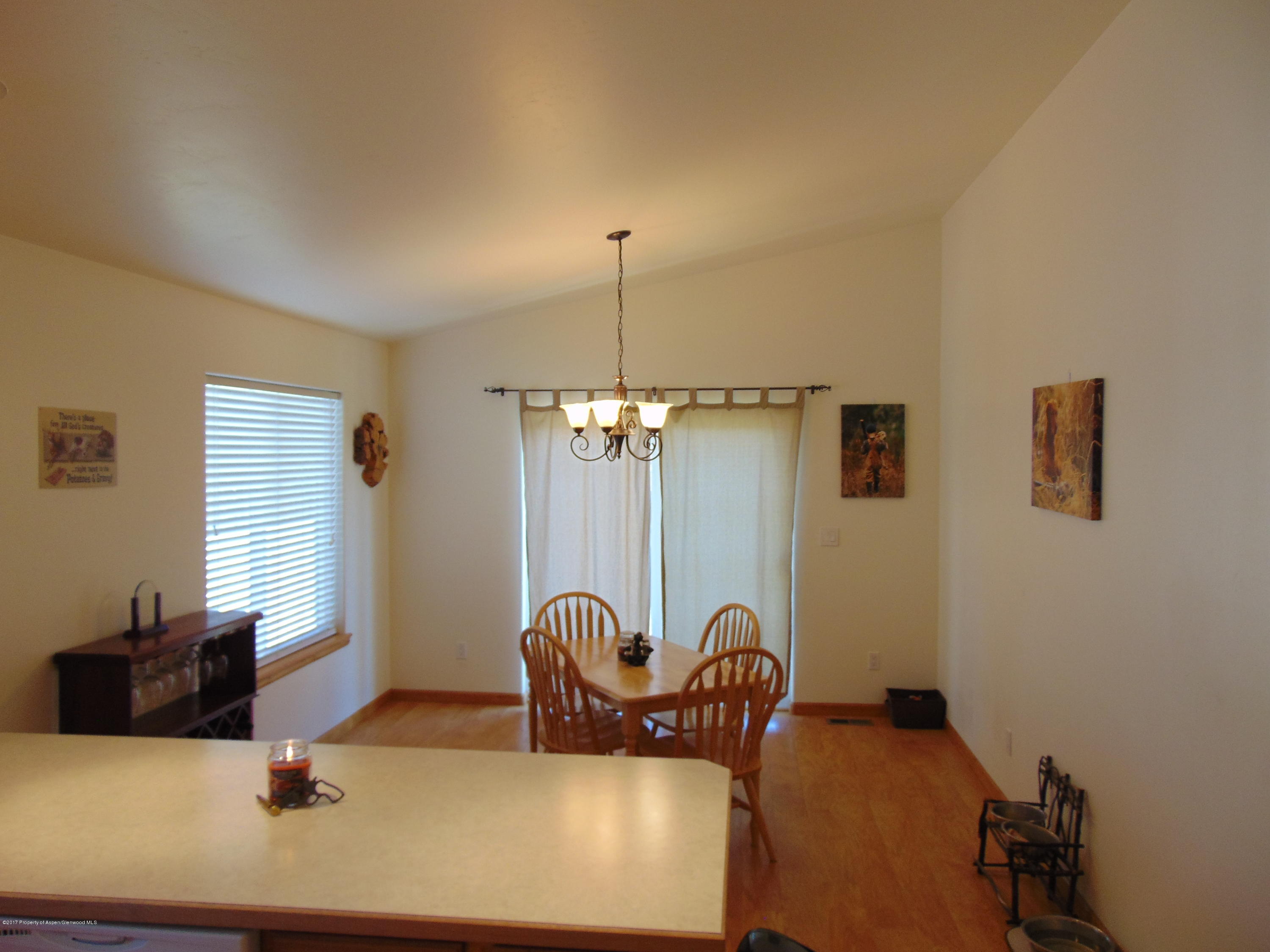 1282 East 17th Street Rifle, CO 81650 - Photo 11 of 25 a living room with furniture a window and gym equipment